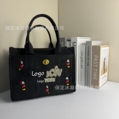カルダモン家2025新型オーレ手提げ大容量トートバッグ丹寧デニム斜めにまたがっています。