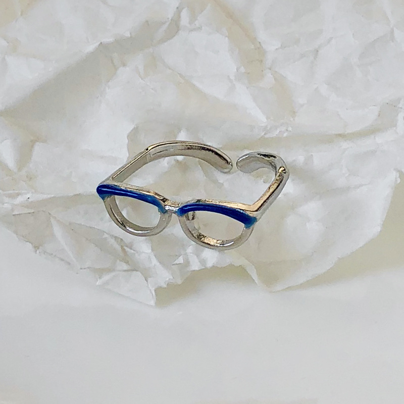 Glasses, blue ring