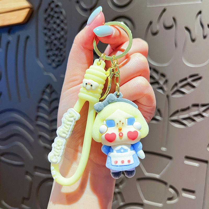 Nuevo llavero de bebé llorando, muñeca de lágrimas, bolso de muñeca, colgante, llavero de coche, colgante flocado de moda al por mayor