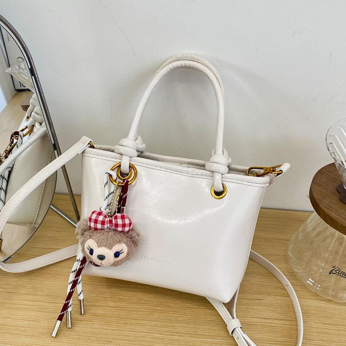 Super caliente versátil bolso de cubo portátil 2025 nuevo popular simple mochila de hombro en línea tendencia explosiva bolso de mujer