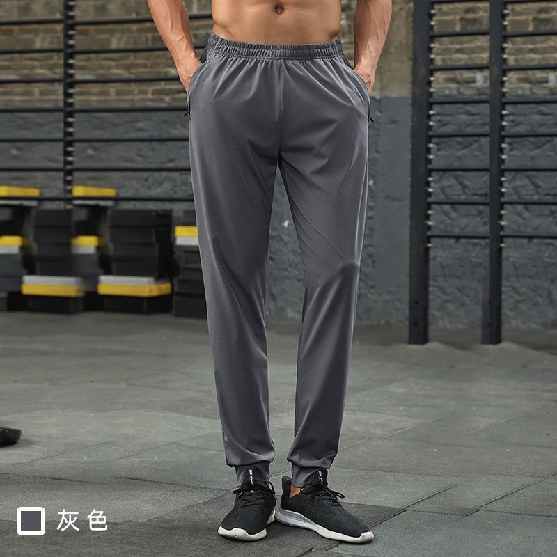 Fábrica de fuerza para correr pantalones deportivos de otoño elásticos rápidamente secos pantalones elásticos transpirables ociosos pantalones de pie delgados