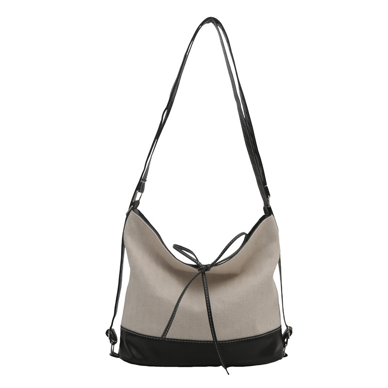 Bolsa de lona de gran capacidad coreana para mujeres 2024 nuevo estilo estilo de moda bolsa de estilo de escuela bolsa especial bolsa de cubo de hombro casual