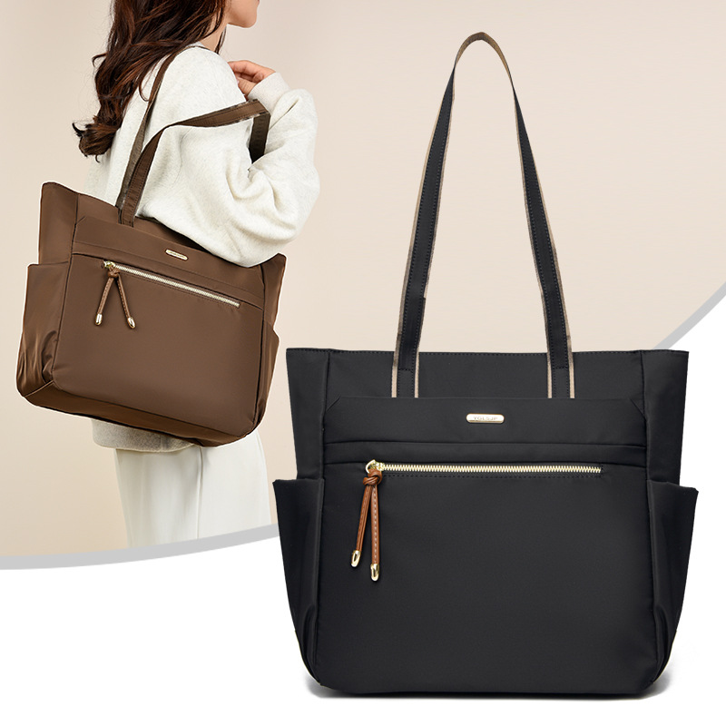 Bolso Tote casual coreano 2025 nueva moda textura de viaje salvaje bolso de mano de un solo hombro suministro directo de fábrica