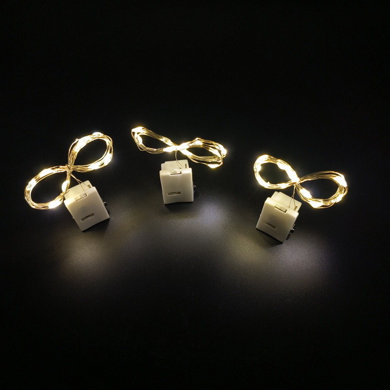 65000810 led铜线小白盒灯串-1米10灯 暖白