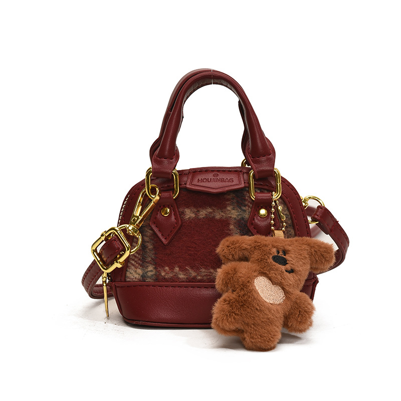 Mochila de moda de leopardo para niñas, mini bolso de concha portátil para bebés, 2025 nuevo bolso de comercio exterior para niños
