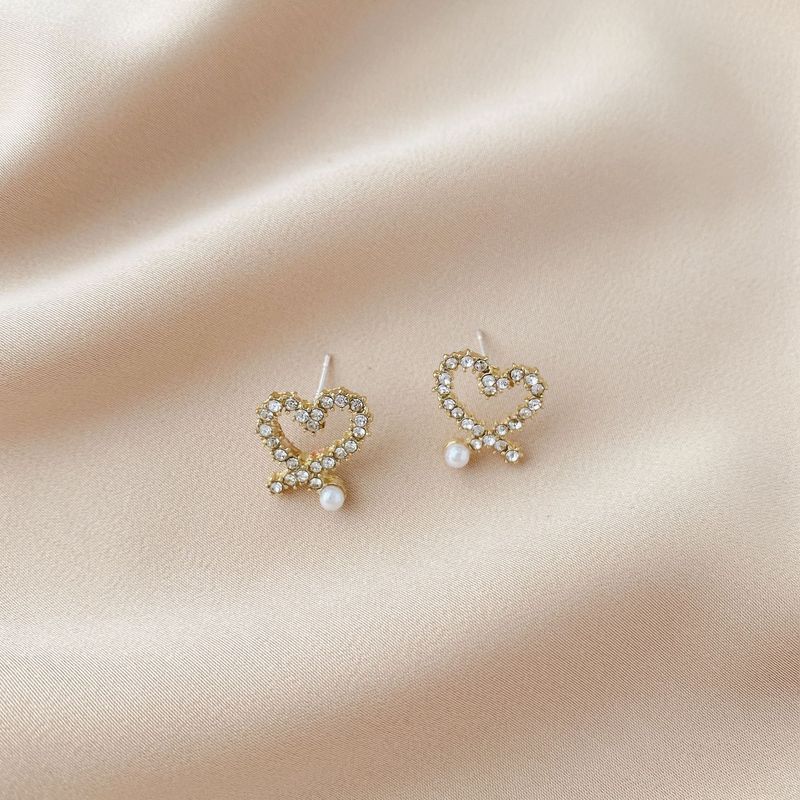 Pendientes de perlas, pendientes de estilo caliente, lujo ligero, pendientes simples de celebridades de Internet, accesorios de Yiwu, venta al por mayor