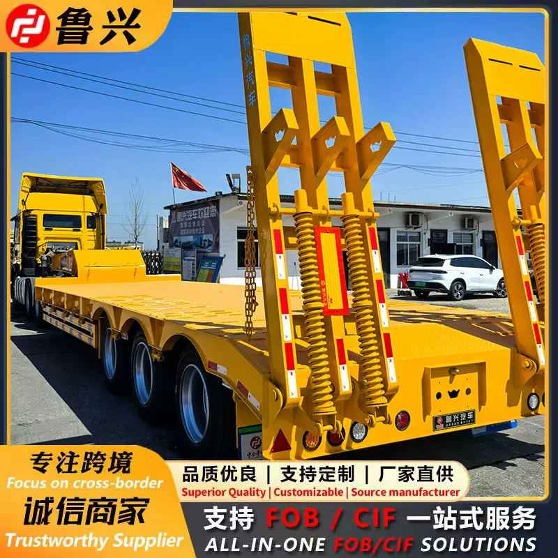 重型液压爬梯低平板运输车 凹梁式钩机板半挂车 双桥平板半挂车