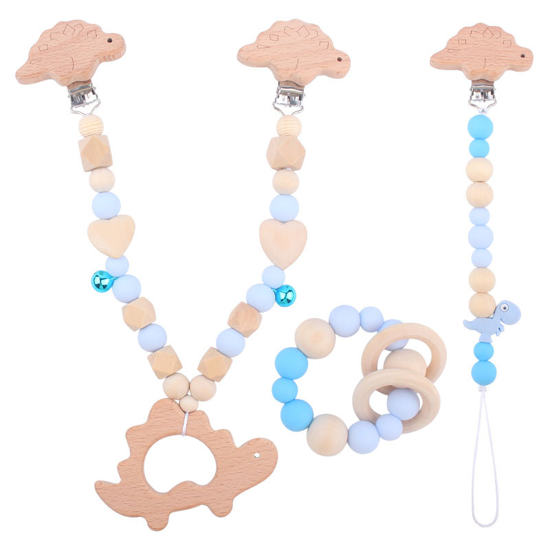 Suministros para bebés pulsera de silicona molar de juguete para niños Cadena de cochecito de dinosaurio de tres piezas creativa pequeña campana colgante