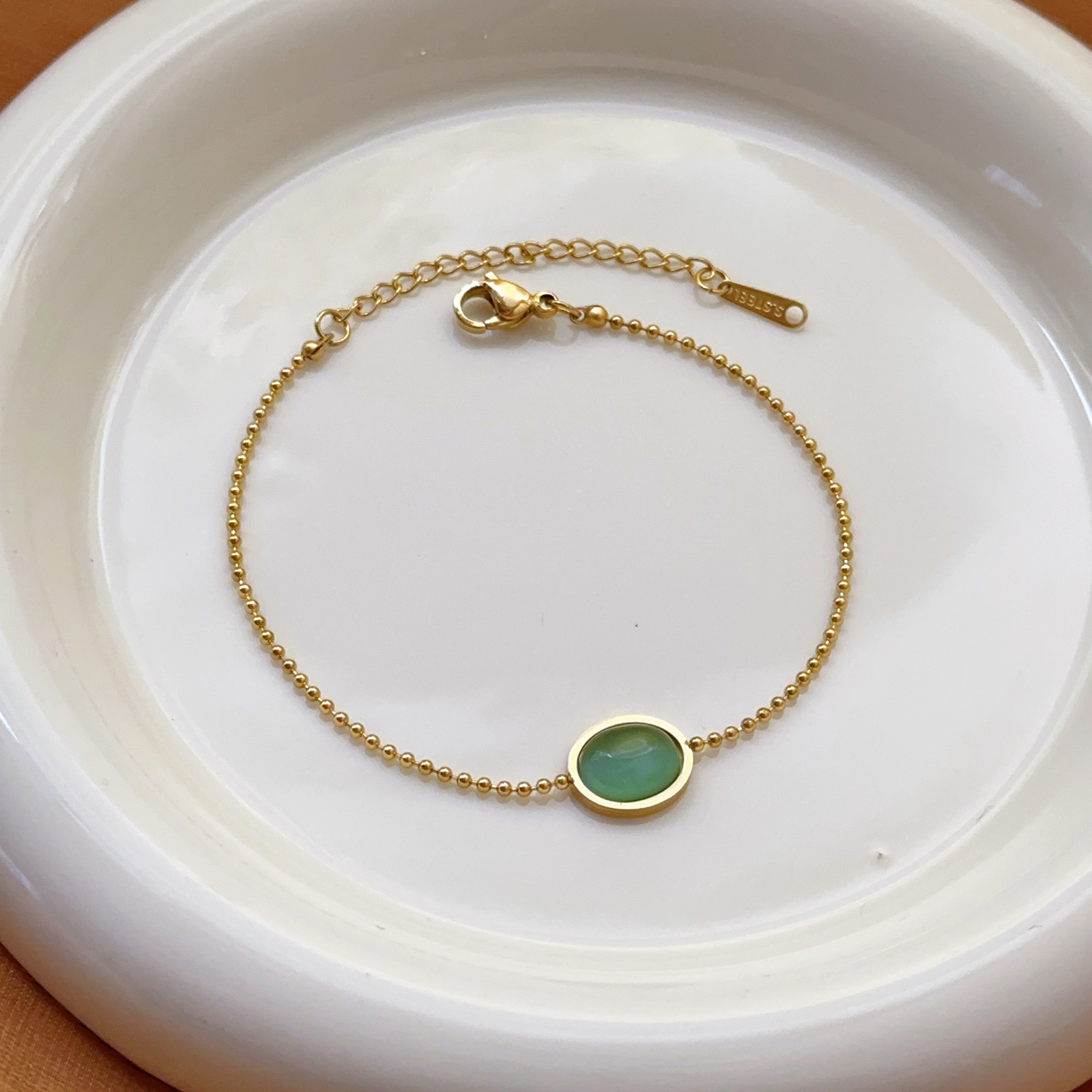 Nueva pulsera de acero de titanio simple sin decoloración, niña, sentido de alta gama, gota de agua, moda de verano, corazón de amor de lujo ligero, tobillera, todo fósforo