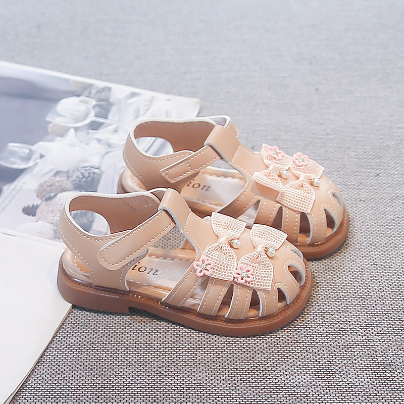 Niñas sandalias huecas de verano 2026 nuevos zapatos de princesa de arco para niños con suela suave zapatos de playa transpirables