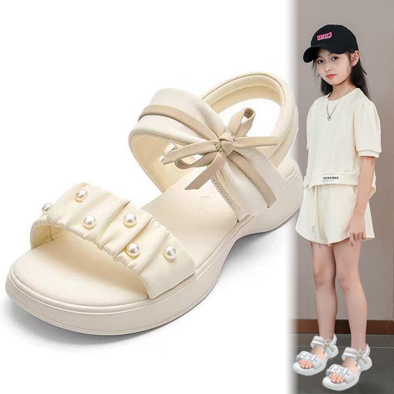 Zapatos de playa de moda de niñas versátiles 2026 verano nuevos zapatos de arco para niños Lefour zapatos de princesa huecos