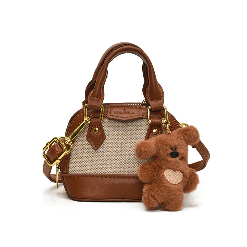 Mochila de moda de leopardo para niñas, mini bolso de concha portátil para bebés, 2025 nuevo bolso de comercio exterior para niños
