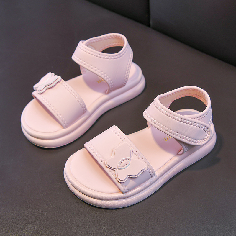 Zapatos casuales de moda de niñas versátiles 2026 verano nuevos niños sandalias de dedos abiertos huecos zapatos de princesa mariposa