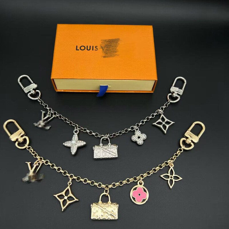 Vuitton Louis Vuitton Chain Bag Pendant, Available in Silver/Gold, with Lv Letters and a Four-Leaf Clover on the Chain