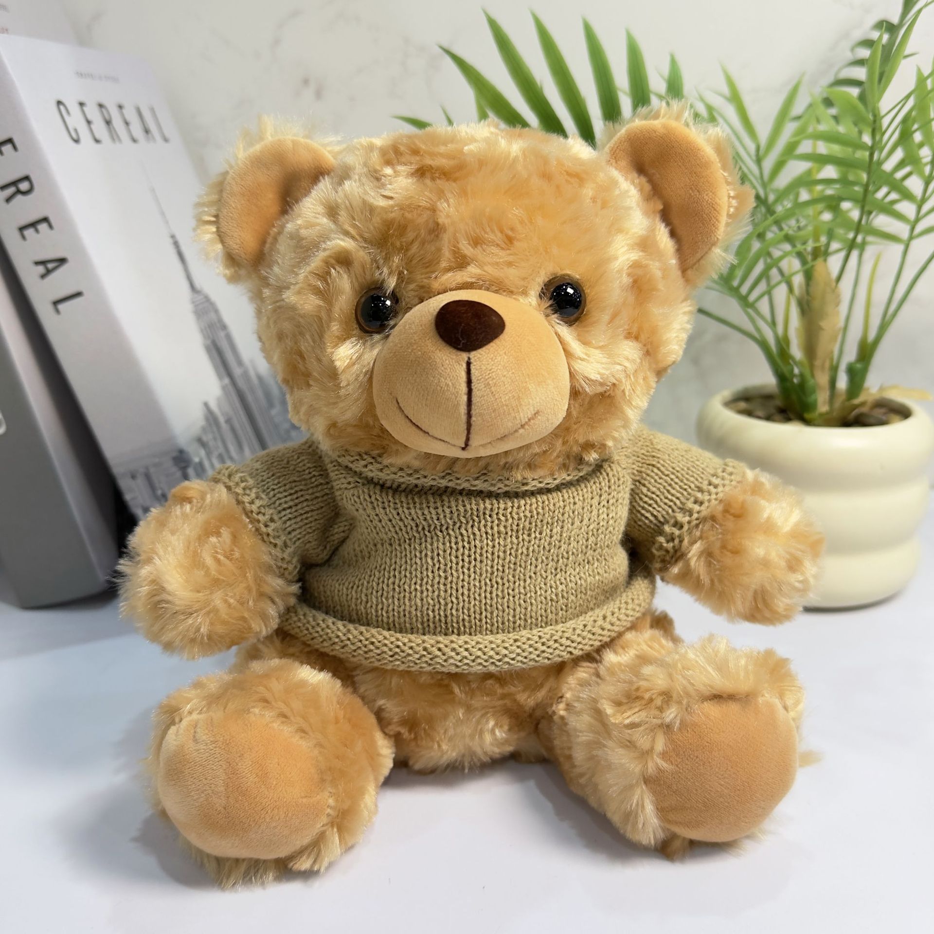 El oso marrón suéter marrón