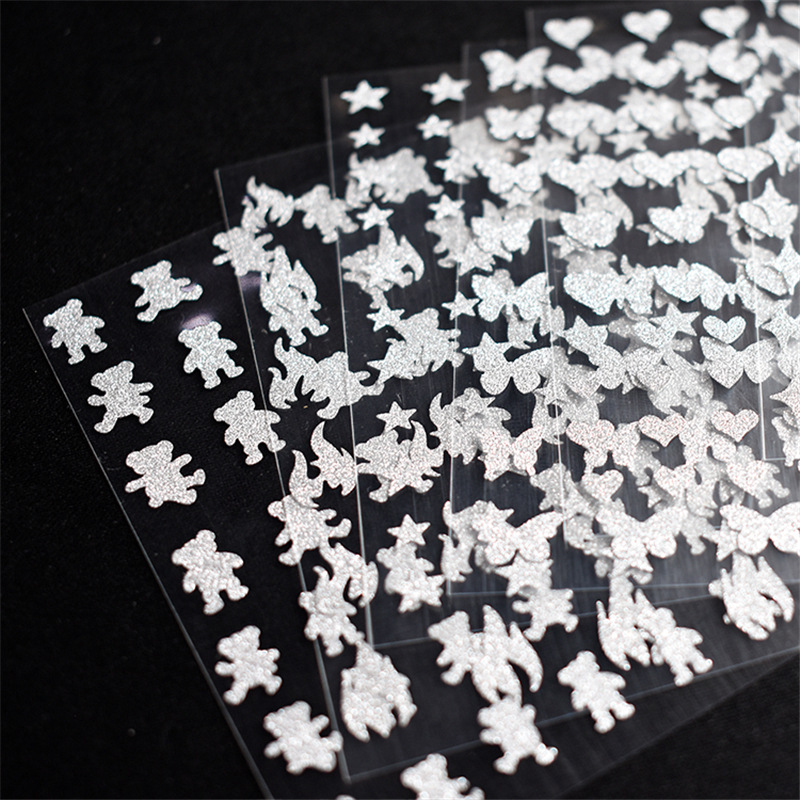 Nueva línea rojo plata brillante corazón estrellado uñas pegatinas mariposa oso llama estrella uñas pegatinas papel con adhesivo