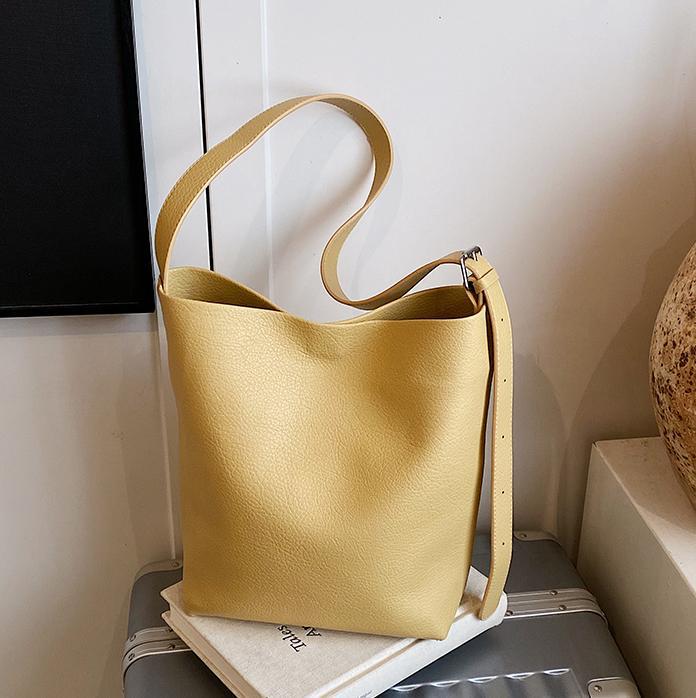 Bolso de cubo de mano de moda de comercio exterior para mujer 2025 nuevo bolso de hombro simple de venta caliente versión coreana bolso casual de alta gama