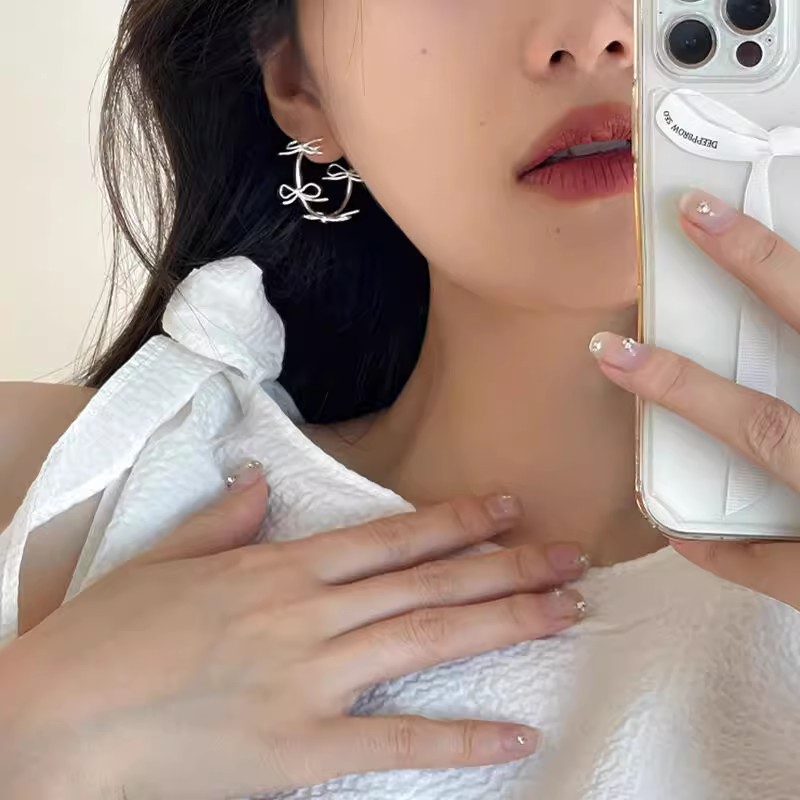 Small design elegant fashionable earrings with bow
