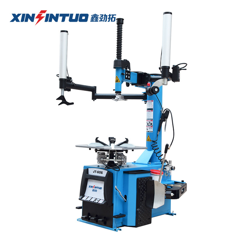 Desmontadora de neumáticos totalmente automática Jintuo, máquina desmontadora de neumáticos potente a prueba de explosiones con brazos auxiliares duales y sistema neumático.