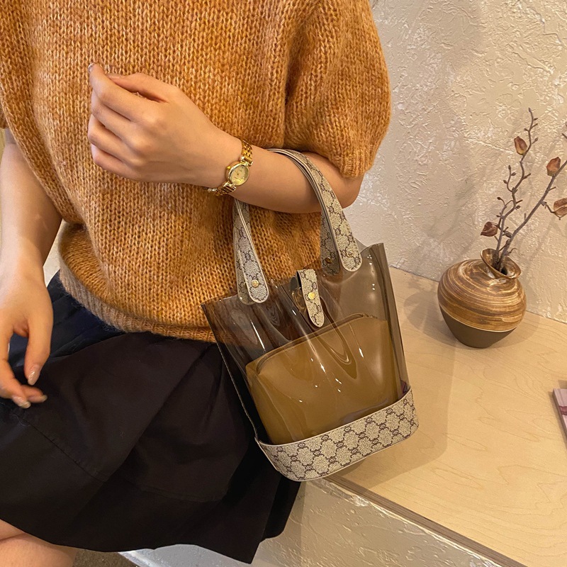 Bolsa de cubo transparente de moda de empalme de primavera y verano de 2026 nueva impresión de contraste de color personalidad bolso de hombro de textura mochila de moda