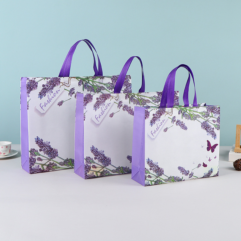 Bolsas de mano no tejidas al por mayor bolsas de embalaje estereoscópicas resistentes al desgaste bolsas de embalaje de dormitorios de estudiantes bolsas de mano en stock