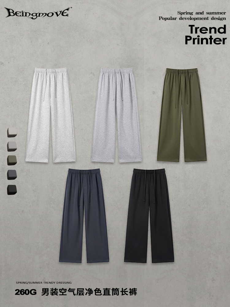 Calle seca nueva tela de capa de aire transpirable color sólido pantalones rectos cuerdas sueltos pantalones deportivos casuales para hombres