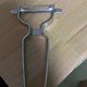 Stainless steel scraper (cannot be removed)