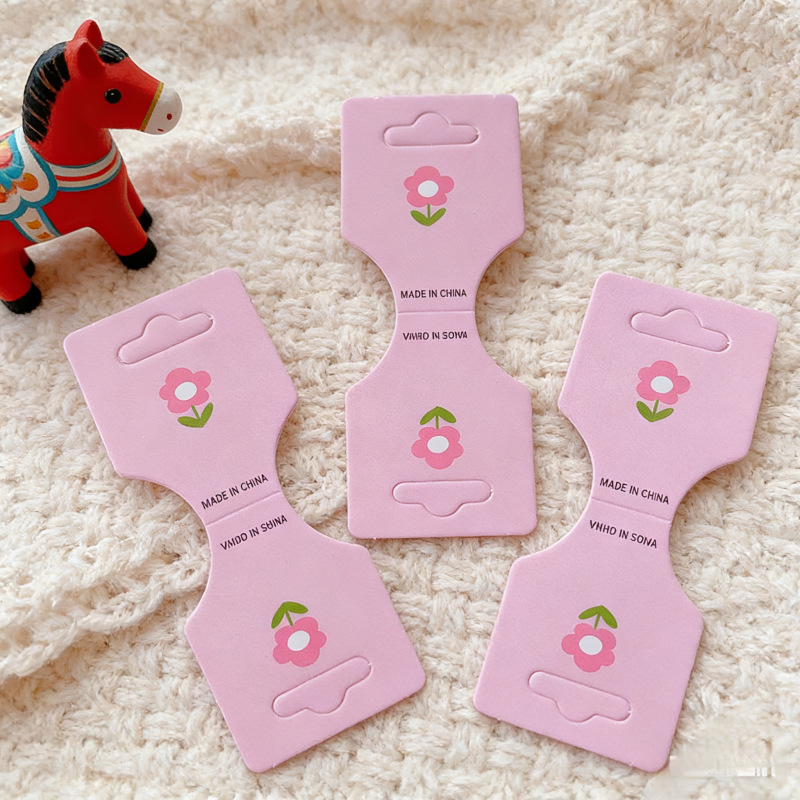 Tarjeta de embalaje de tarjeta plegable especial creativa tarjeta de cuerda de cabello infantil tarjeta de papel de anillo de intestino grueso tarjeta de cabeza de cuerda de papel joyas tarjeta de visualización