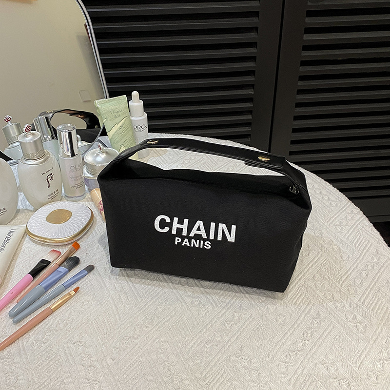 Bolsa de maquillaje de lona simple, nuevo estilo de aire extranjero, bolsa de mano de gran capacidad de almacenamiento, bolsa de almacenamiento simple para viajes