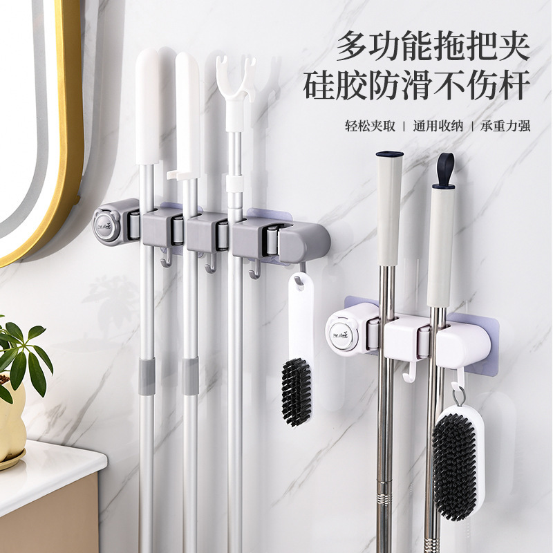 No-Drill Adhesive Wall-Mounted Mop Holder, Multifunctional Storage Solution for Kitchen and Bathroom, with Hook and Clip for Wall Storage No-Drill Adhesive Wall-Mounted Mop Holder, Multifunctional Storage Solution for Kitchen and Bathroom, with Hook and Clip for Wall Storage