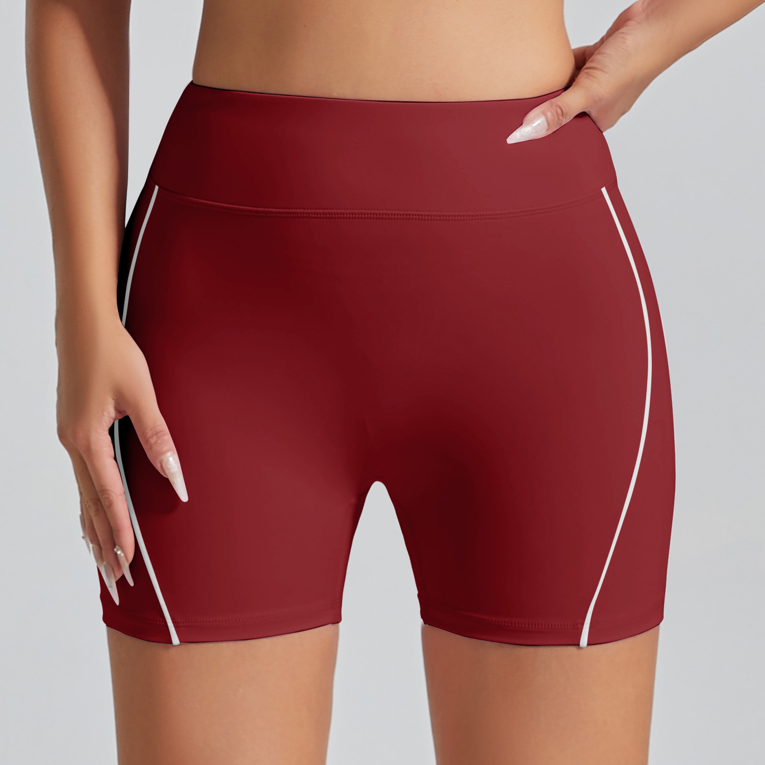 Pantalones cortos deportivos de color de contraste europeo y americano sin línea de vergüenza Cintura alta, ajustados desnudos, pantalones de yoga de fitness de cadera de melocotón, pantalones de tres puntos