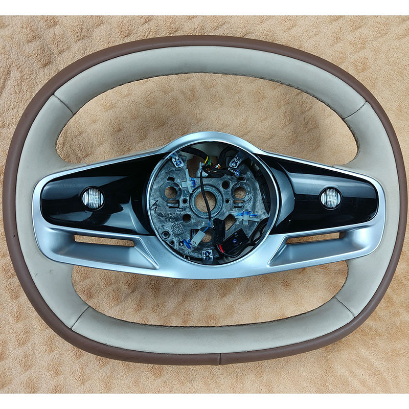 Compatible with Chery iCAR V23 steering wheel assembly 404AA1, featuring a two-tone genuine leather design and multi-functional buttons. Quality guaranteed