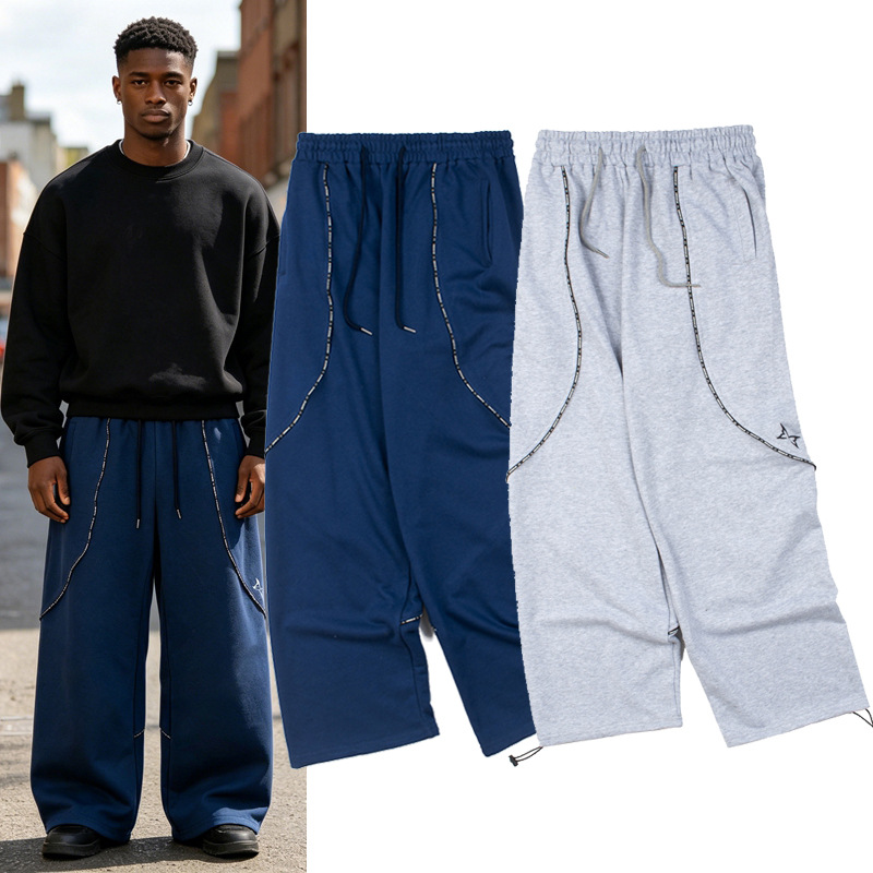 Mertra, a trendy European and American brand, presents retro high-street patchwork embroidered letter webbing casual loose terry sweatpants.