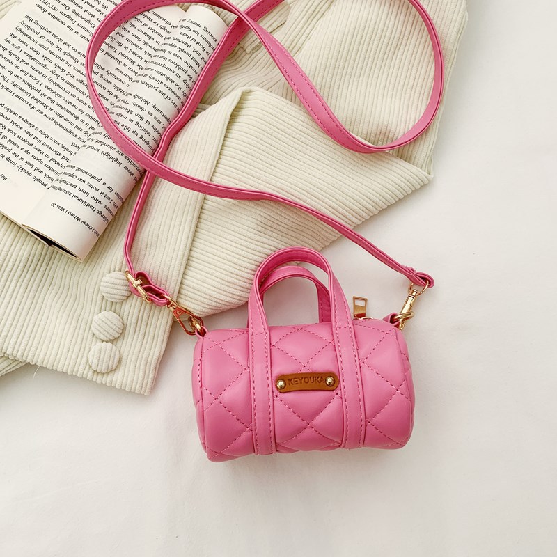 Bolsas infantiles simples de color sólido, bolsas de mini barril de moda coreana, 2025 nuevas bolsas para bebés de comercio exterior