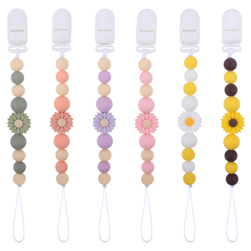 Suministros para bebés de dibujos animados flor mordedor calmante bebé de silicona mordedura pegamento molar Cadena de pezón cadena anti-caída Nuevo