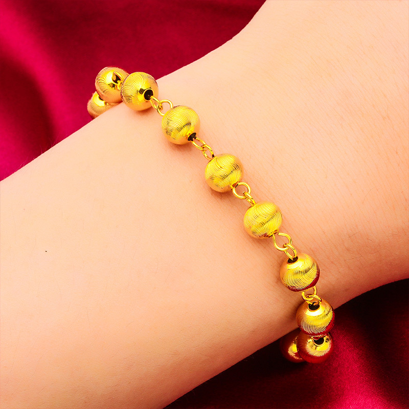Pulsera unisex de moda con diseño de ojo de gato en oro y arena_voghion.com