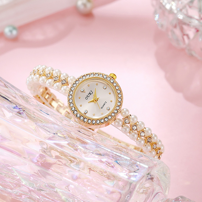 Reloj de pulsera de perlas con cara de gota de agua redonda de lujo ligero transfronterizo moda hecha a mano con cuentas regalo temperamento reloj de mujer al por mayor