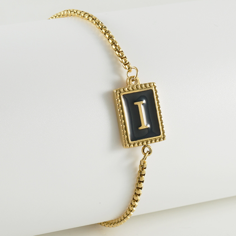 La moda europea y americana transfronteriza del acero inoxidable 26 pulsera inglesa de la letra en relieve pulsera Titanium de la cremallera del acero 18K de la frontera para las mujeres