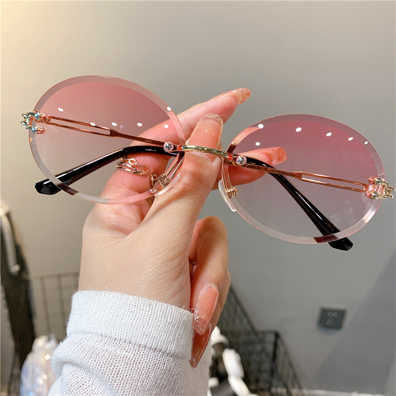 New Sunglasses Women's Oval Gradient Sunglasses Frameless Cutting Edge Trendy Glasses_voghion.com
