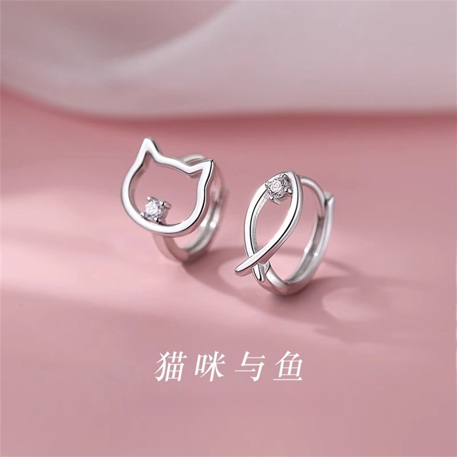 Asymmetrical small design elegant earrings with zircon