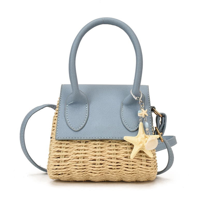 Mini bolso nuevo verano 2026 tela de paja de moda nicho sensación diaria bolso de hombro bolso de mochila