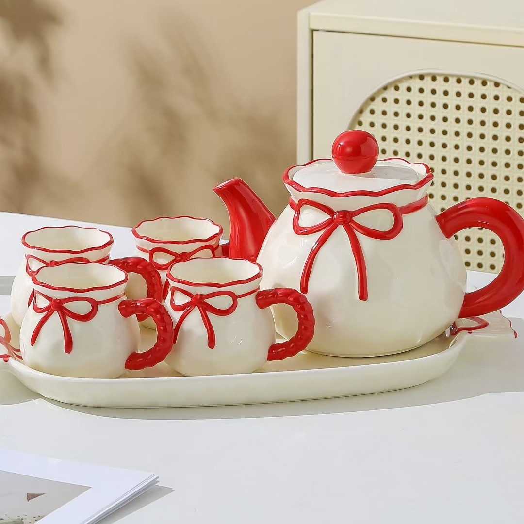 Personalidad creativa de alto valor facial arco hervidor de agua fría conjunto de tazas de cerámica acuario conjunto de nicho regalo de cumpleaños