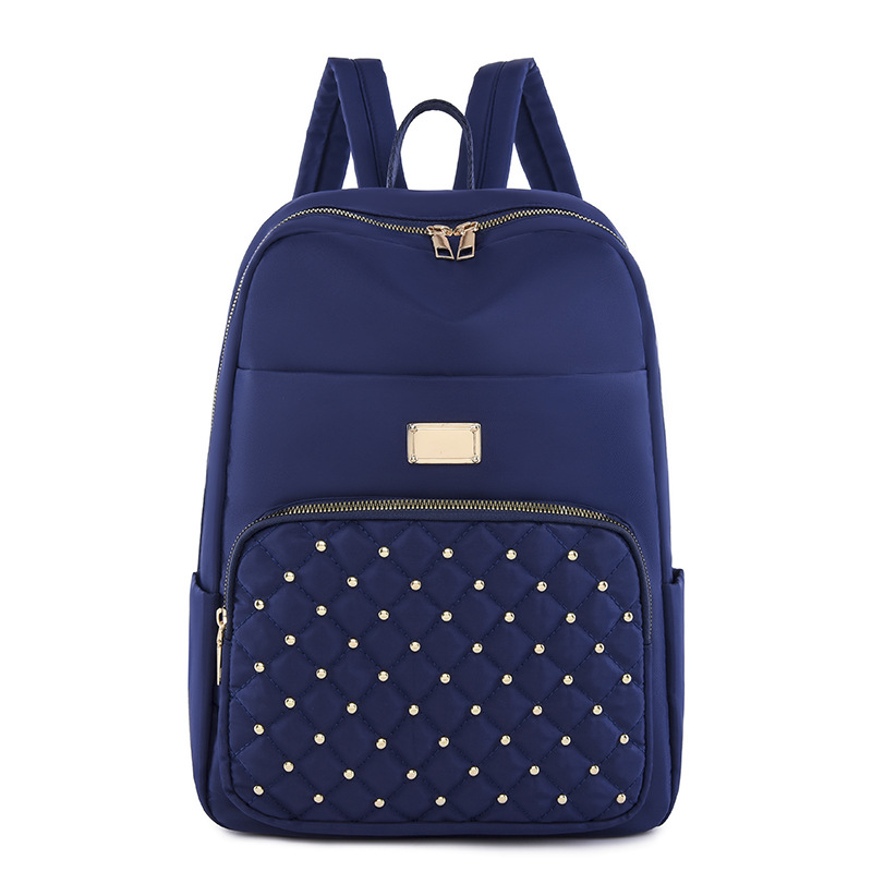 2023 nueva mochila de tela Oxford para mujer casual moda rombo remache mochila ligera mochila de viaje urbano