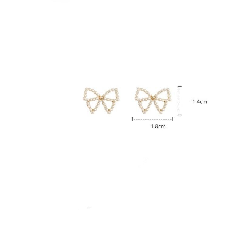 Simple Style Bow Knot Inlaid Pearls Alloy No Inlaid Earrings Ear Studs display picture 1