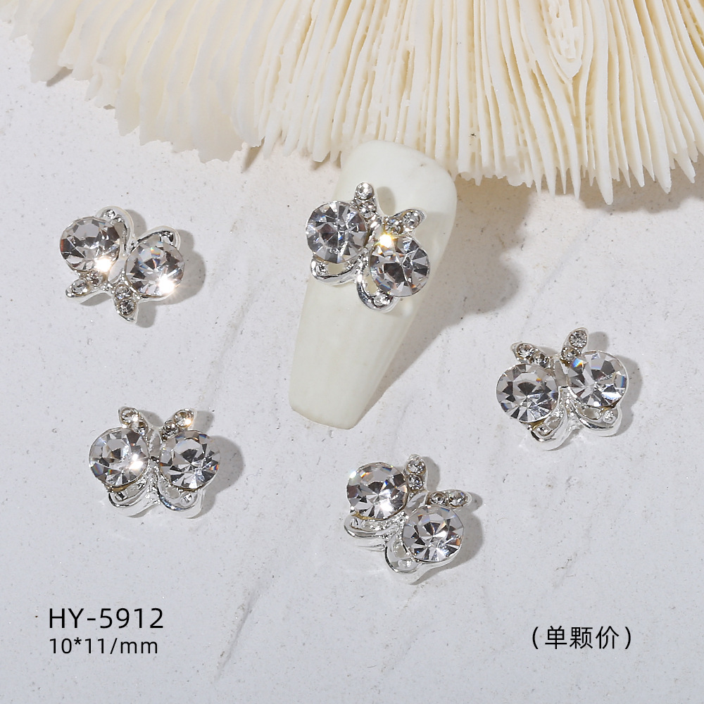 Venta caliente taladro de uñas arco de plata joyería tridimensional flash diamante esmalte de uñas decorativo diamante acabado pieza de uñas traje de joyería