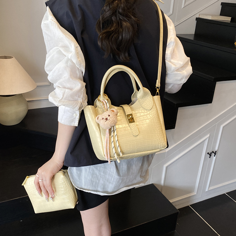 Comercio exterior super fuego patrón de cocodrilo llevar a mano bolso de cubo mujer 2025 nuevo bolso de hombro de viaje de moda bolso de mensajero de todo fósforo