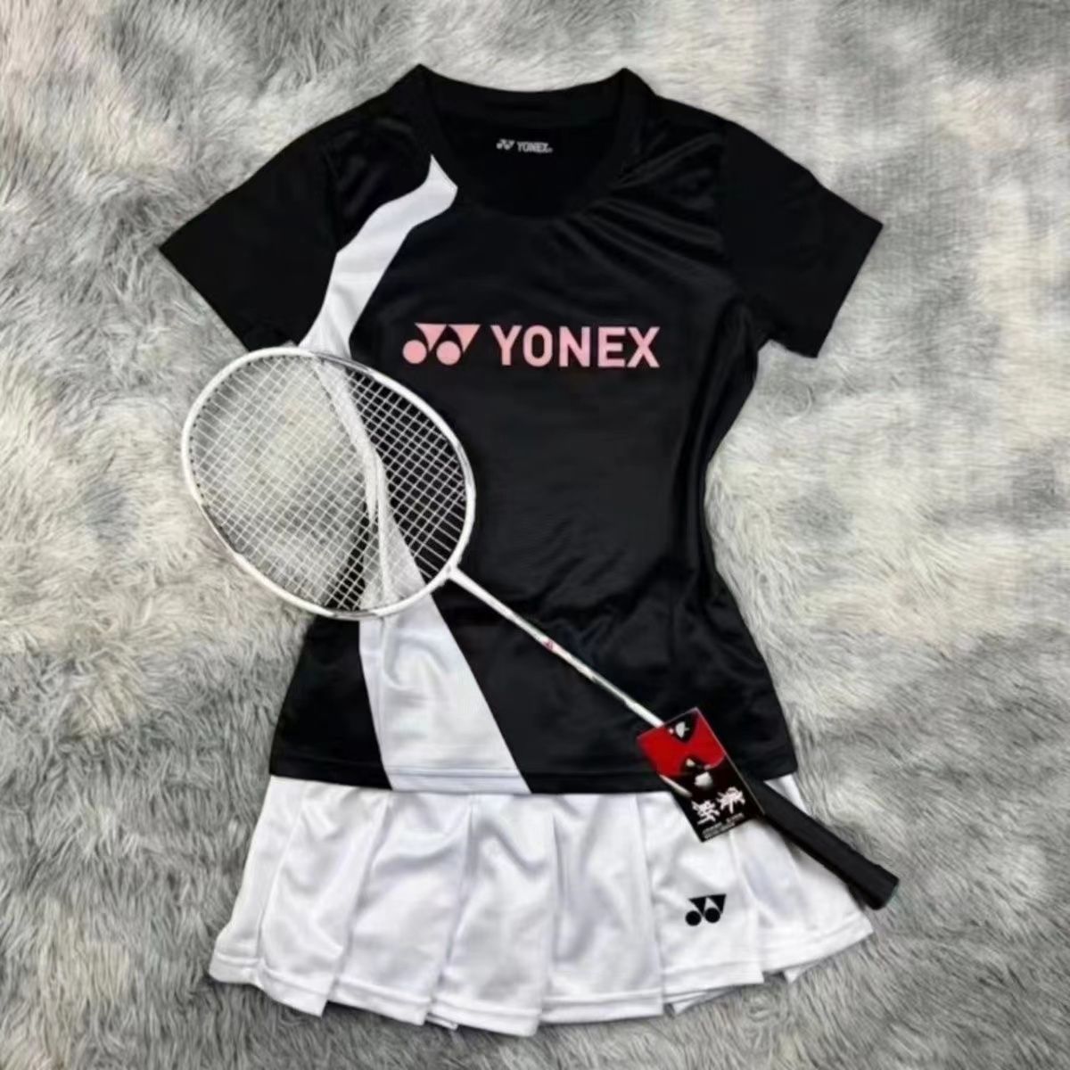 Women's black top + white pleated skirt suit