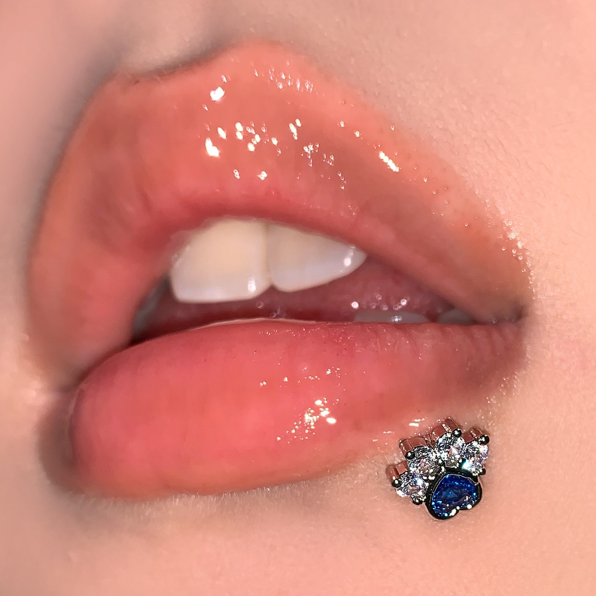 Silver pointed spike labret stud material detail