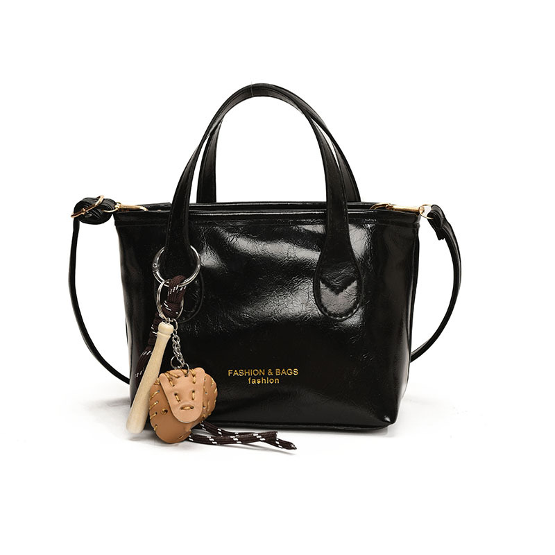 Bolso de cubo de textura de color sólido para mujer 2025 primavera nueva moda bolso de mensajero coreano estilo occidental de alta gama para mujer