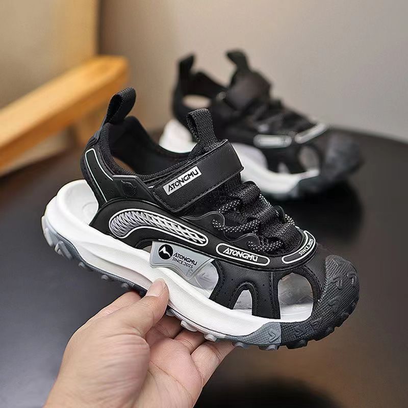 Niños sandalias Baotou 2026 verano nuevo estilo de moda para niños zapatos de playa para niños zapatillas suaves zapatillas individuales